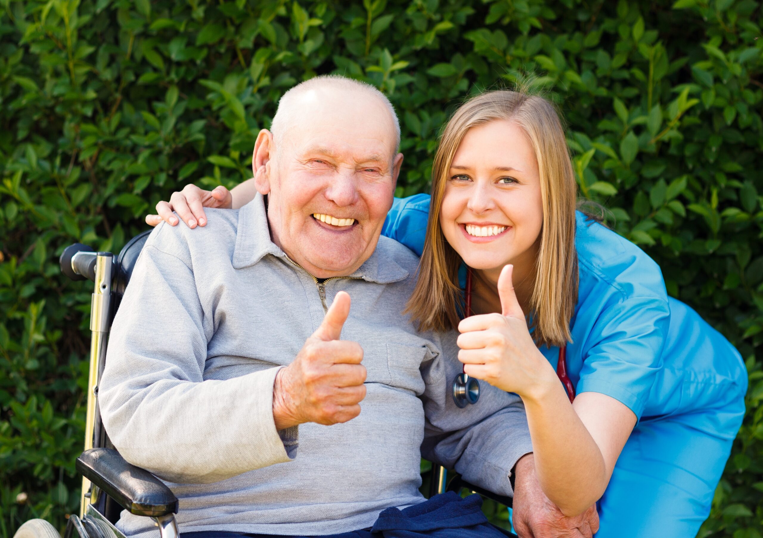 Happy,Smiling,Patient,Showing,Thumbs,Up,Together,With,His,Doctor.